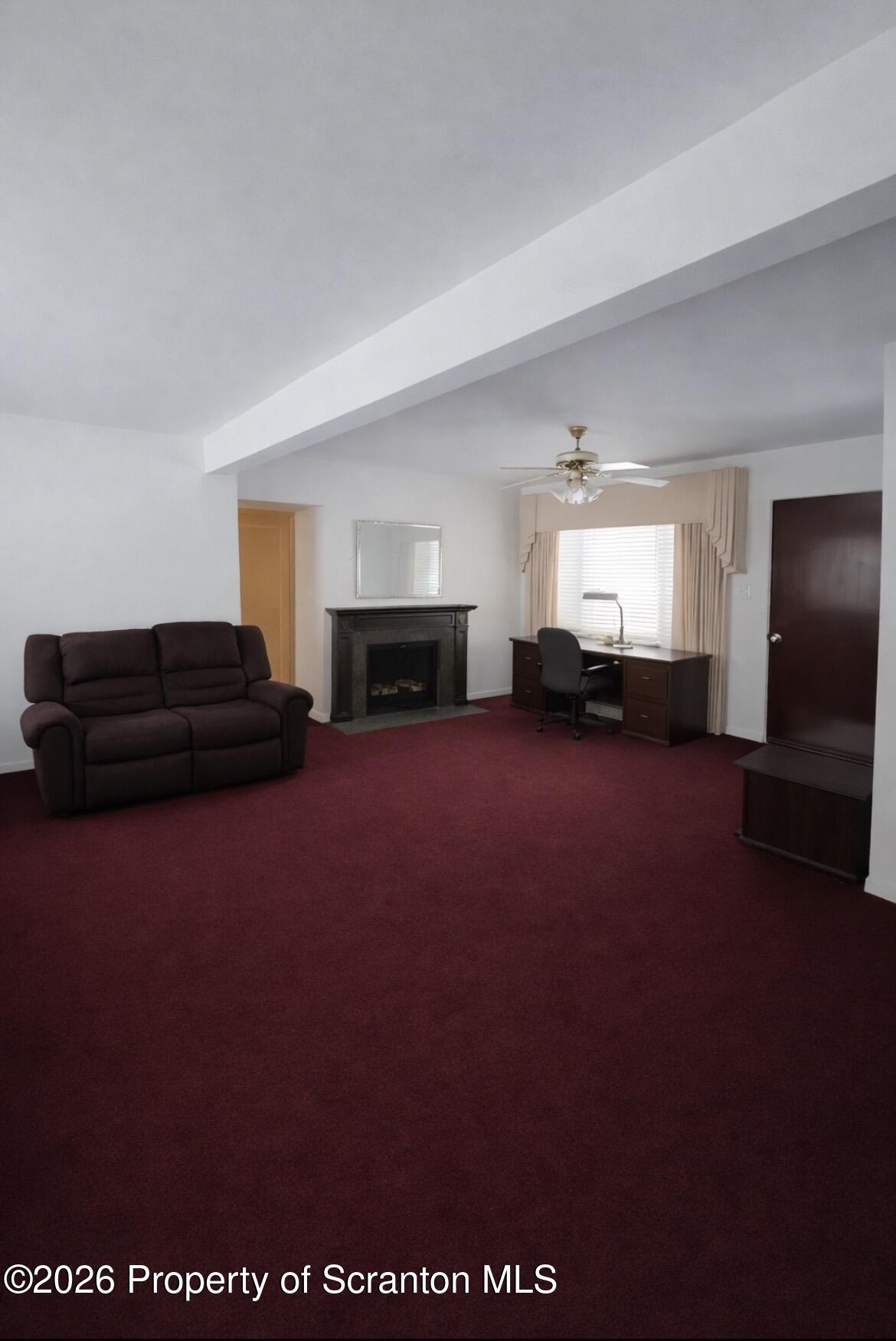 218 Lake Scranton Road Scranton, PA 18505 - Photo 4 of 19 a living room with furniture and a fireplace