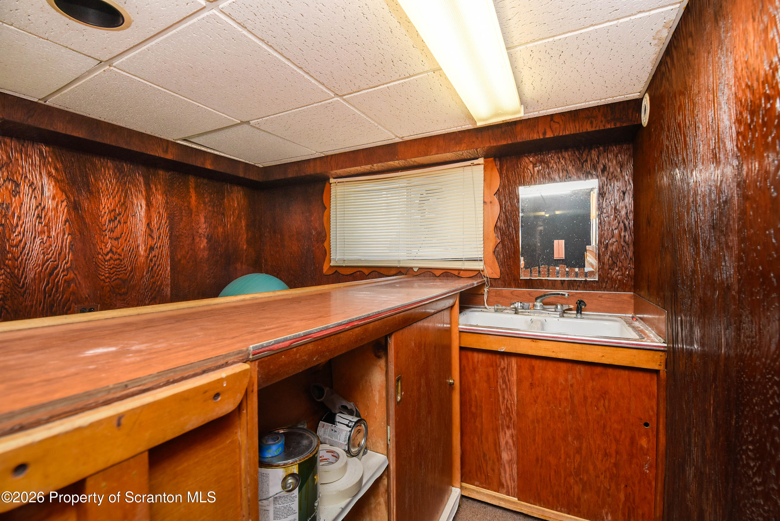218 Lake Scranton Road Scranton, PA 18505 - Photo 42 of 45 a room with a sink a mirror and a shower