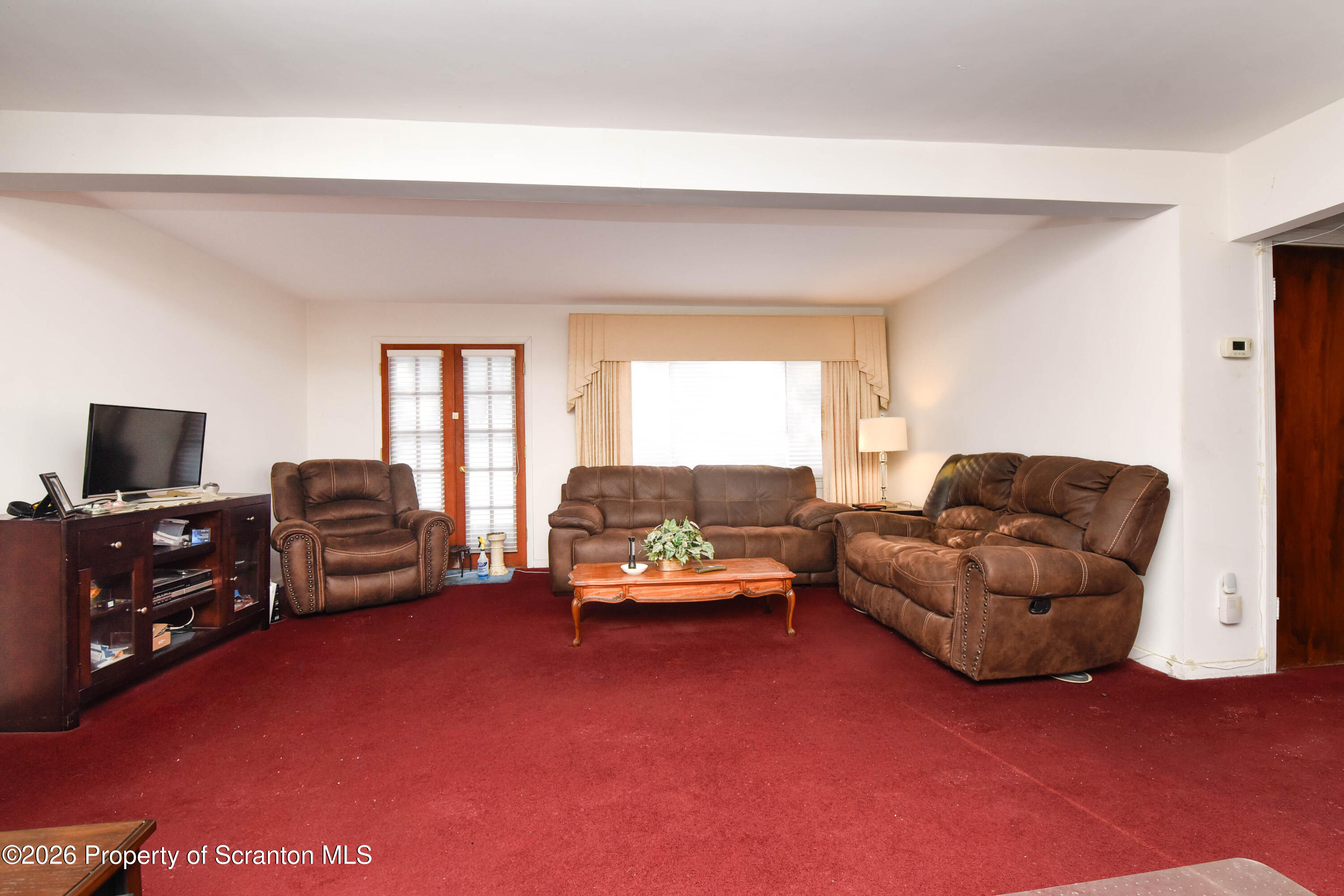 218 Lake Scranton Road Scranton, PA 18505 - Photo 6 of 45 a living room with furniture and a flat screen tv
