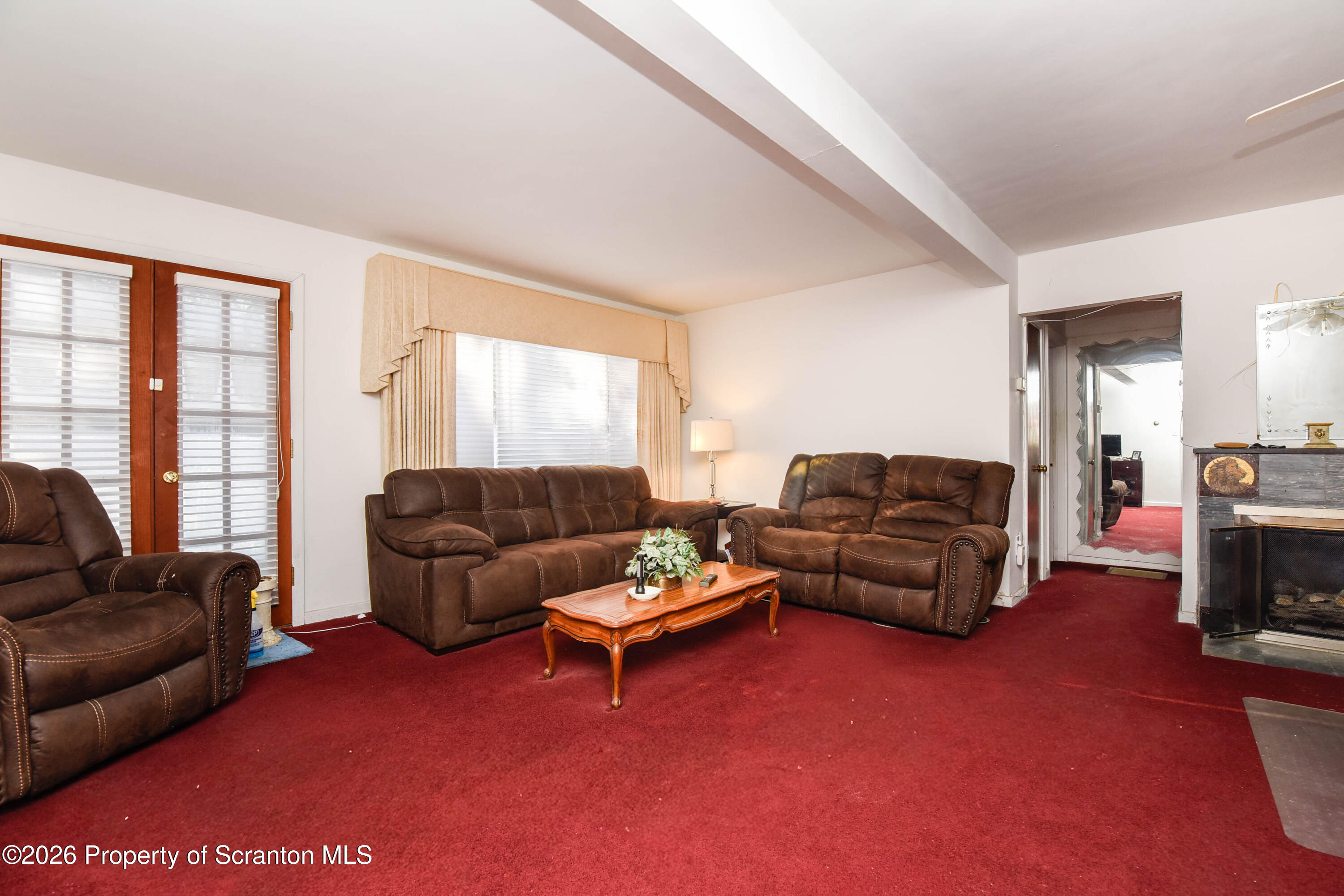 218 Lake Scranton Road Scranton, PA 18505 - Photo 7 of 45 a living room with furniture and a large window