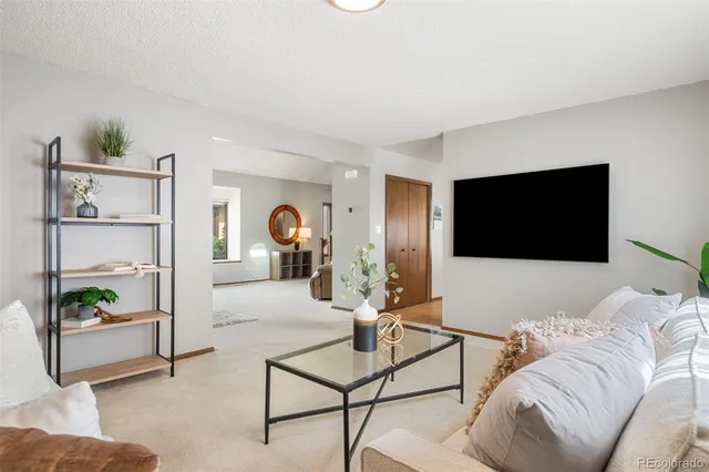 a kitchen with stainless steel appliances granite countertop a refrigerator a sink dishwasher a stove and a refrigerator