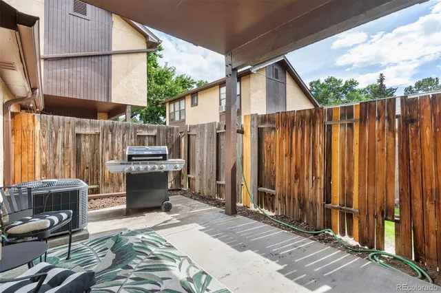 a bedroom with a bed and a flat tv screen on the dresser