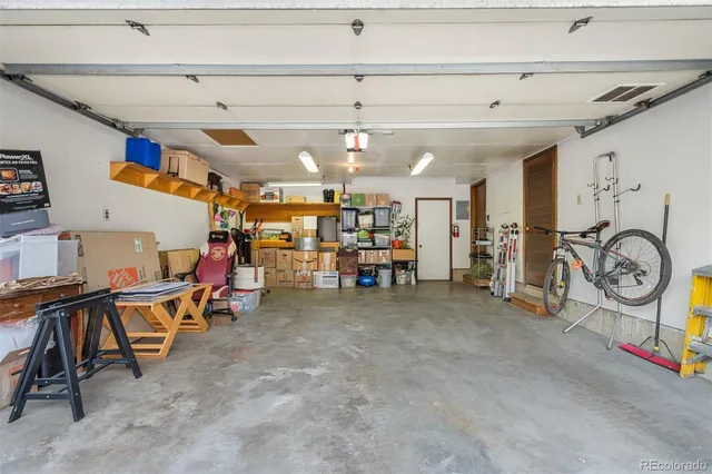 a view of a swimming pool with a patio and a yard