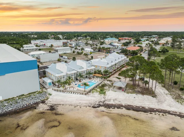 a bed room with a bed a couch and a window