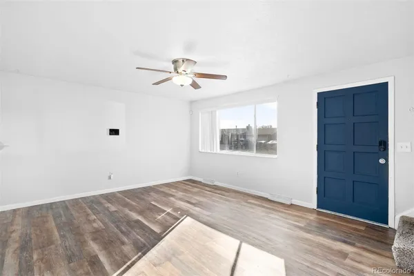 a view of a big room with wooden floor and closet