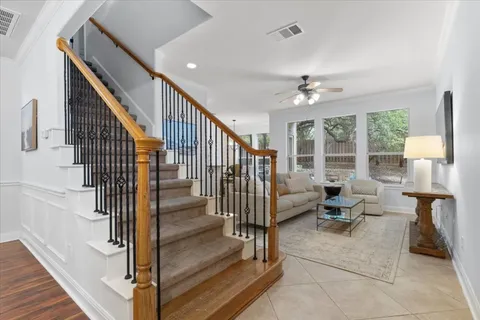 a view of entryway and hall with wooden floor