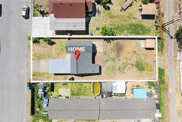 a view of a house with wooden fence