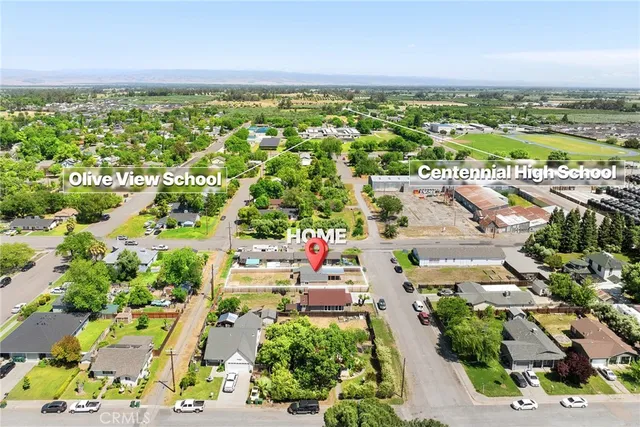 an aerial view of residential building and lake
