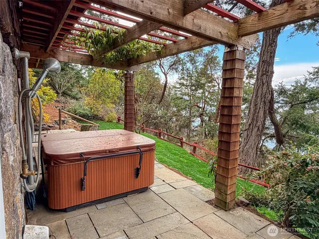a bathroom with a toilet and shower curtain