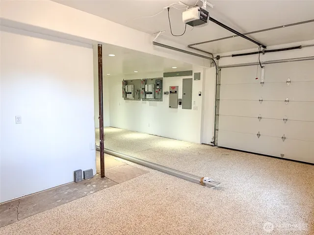 a front view of a house with a deck and furniture