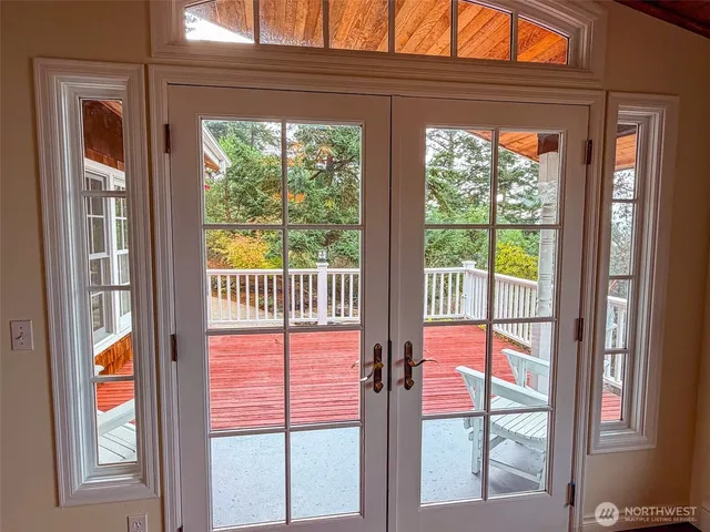 a view of a living room with wooden floor