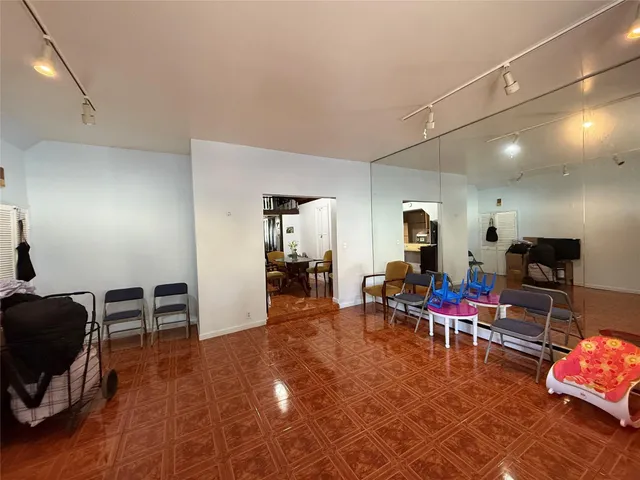 a view of a patio with table and chairs
