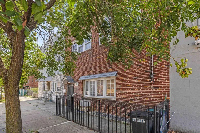 a front view of a house with trees