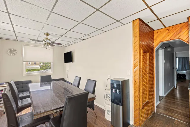 a view of a dining room with furniture and window