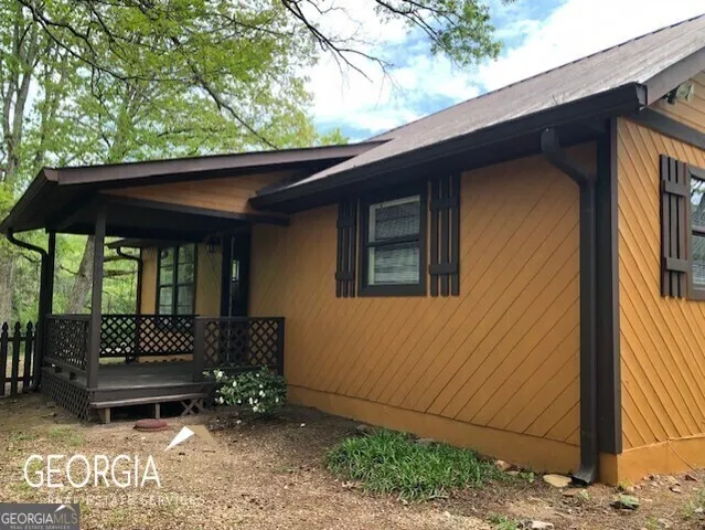 a view of a bench in the backyard