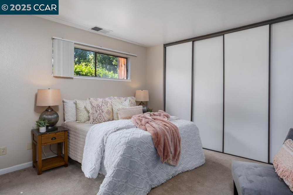 1455 Latour Lane, Unit 43 Concord, CA 94521 - Photo 11 of 17 a bed room with a bed and a window