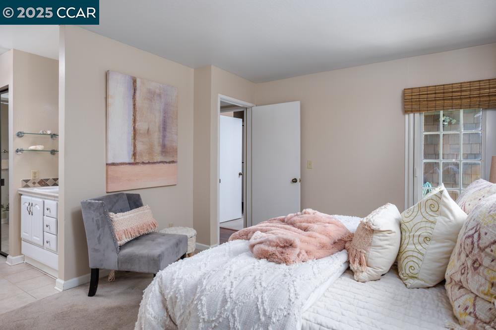 1455 Latour Lane, Unit 43 Concord, CA 94521 - Photo 12 of 17 a bedroom with a bed and a couch