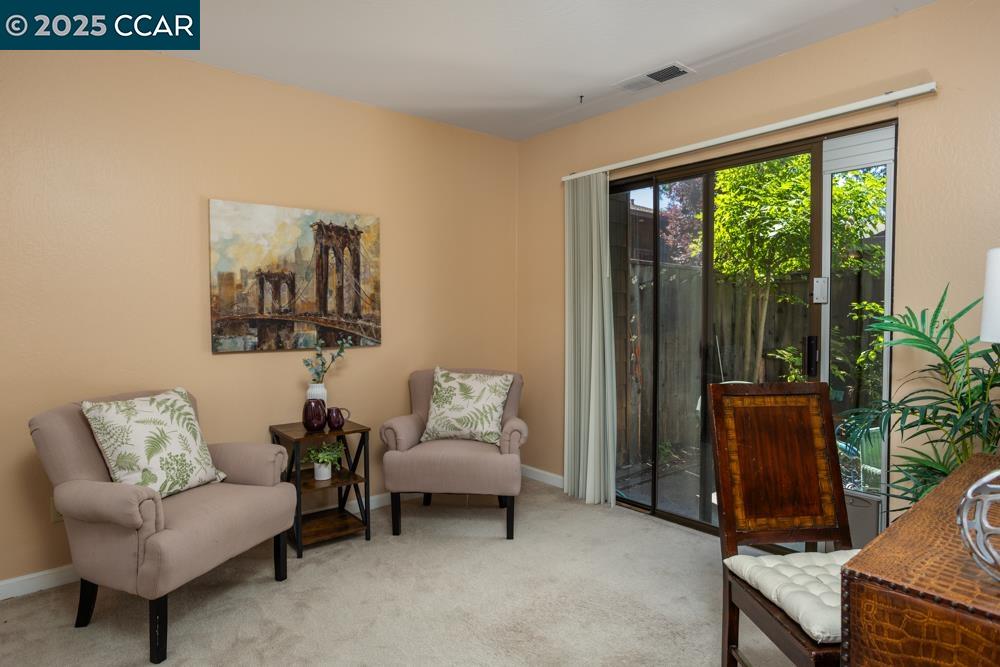 1455 Latour Lane, Unit 43 Concord, CA 94521 - Photo 9 of 17 a living room with furniture and a window