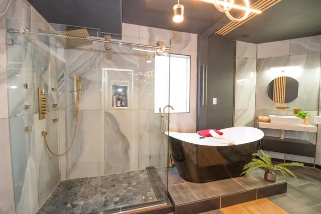 a bathroom with a sink toilet and shower