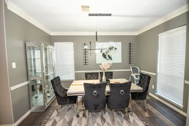 a view of a dining room with furniture window and outside view