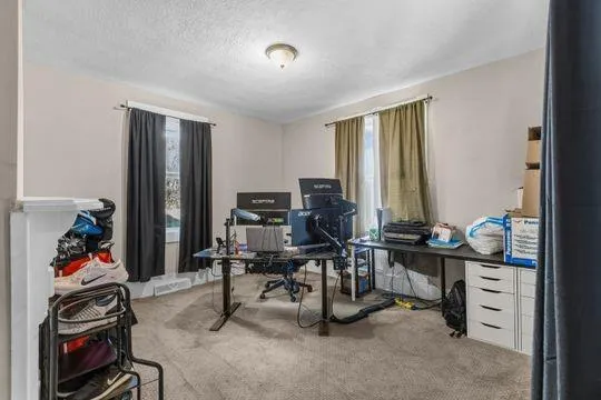 a view of a workspace with furniture