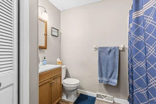 a bathroom with a toilet and a sink