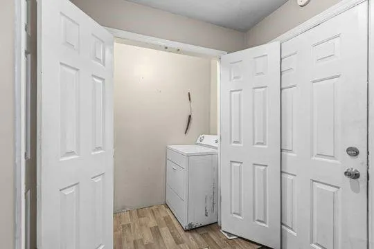 a view of a hallway with closet area
