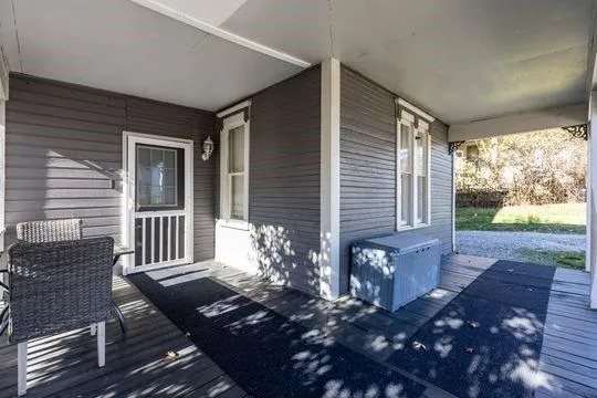 a view of a porch with furniture