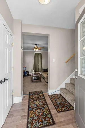 a room with furniture and a rug