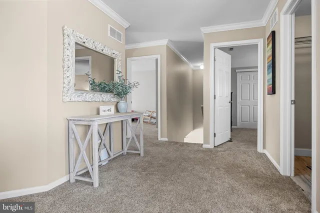 a room with a bed and a chandelier