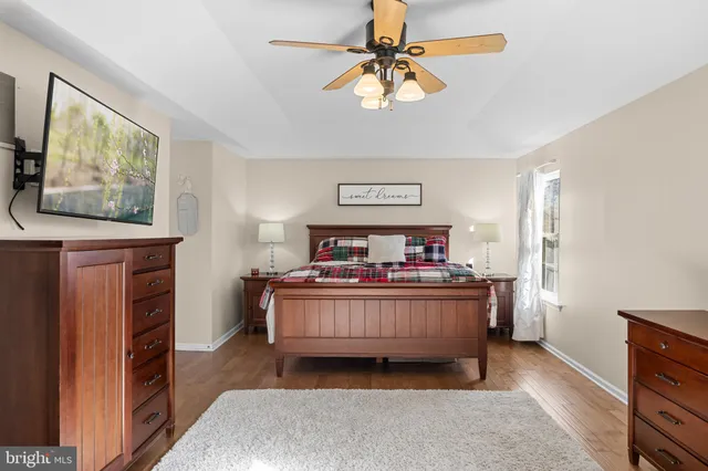 a bedroom with furniture and a window