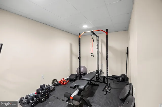 a view of a patio with furniture and a backyard
