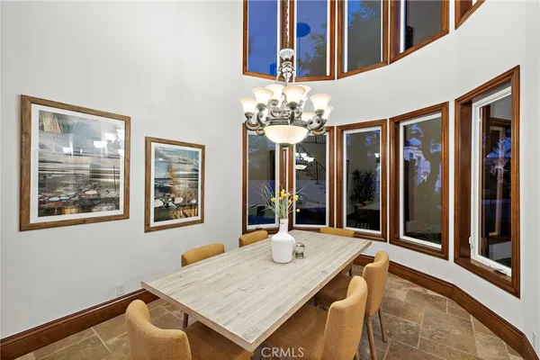 a living room with furniture a clock and a fireplace