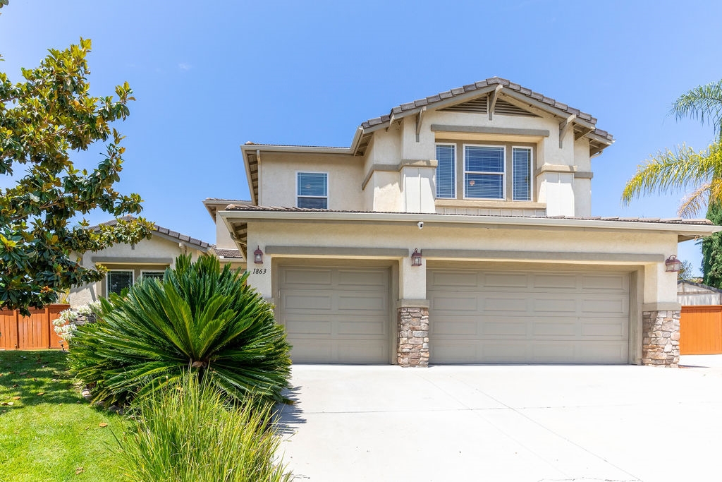 1863 Lawndale Road El Cajon, CA 92019 - Photo 1 of 1 a front view of a house with a garage