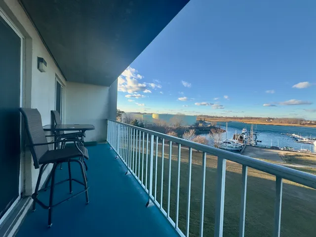 a view of a balcony with chairs