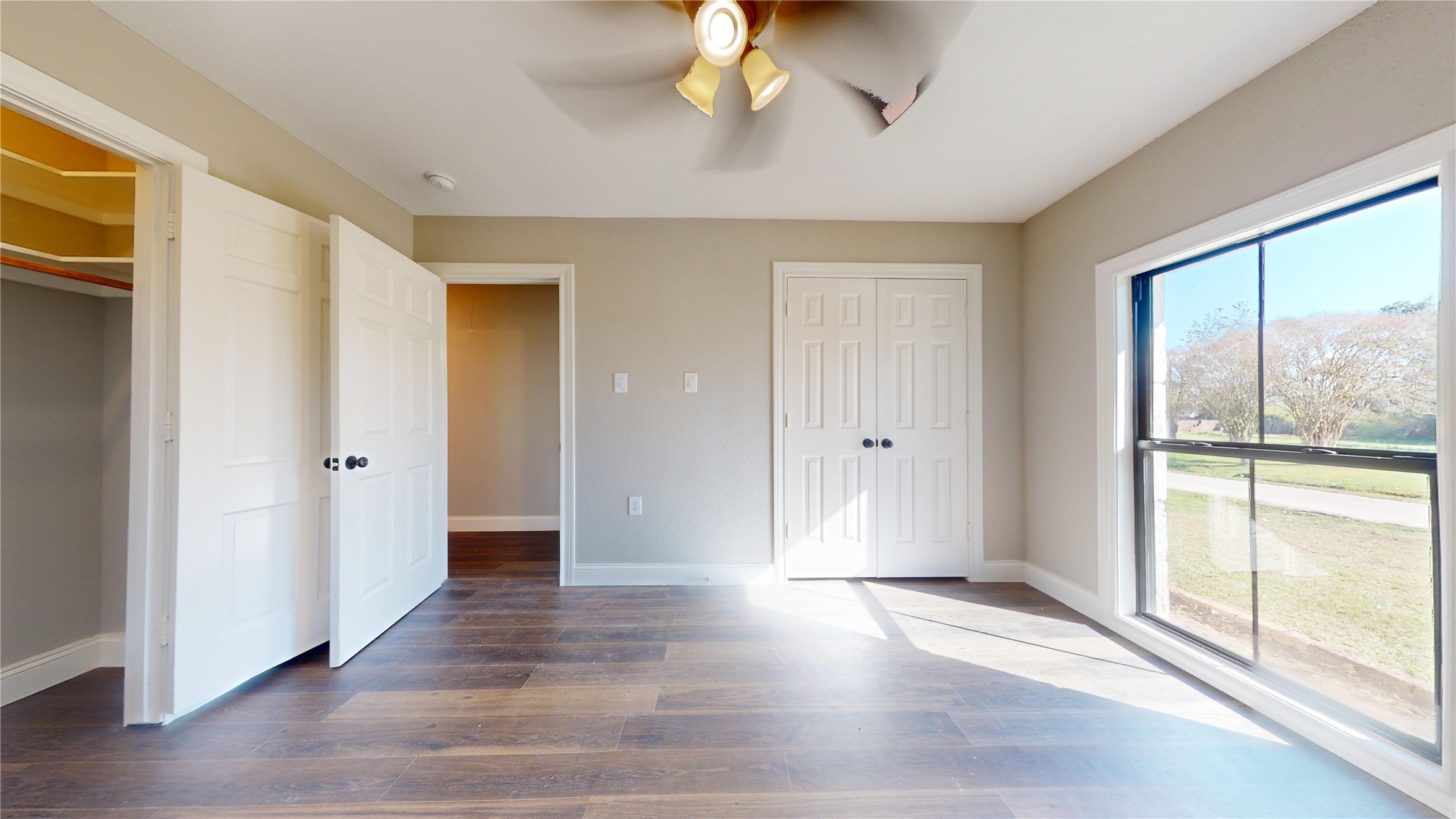 603 Maple Way Houston, TX 77015 - Photo 25 of 35 a view of an empty room with wooden floor and a window