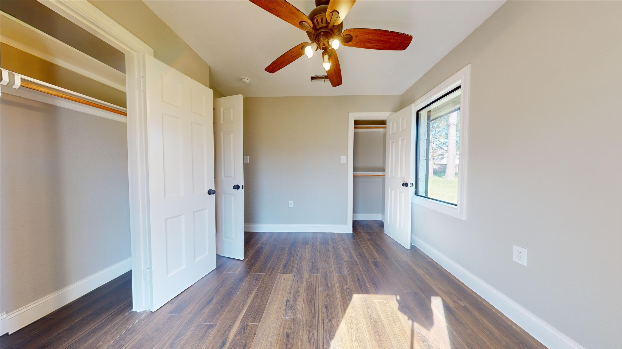 603 Maple Way Houston, TX 77015 - Photo 28 of 35 a view of a livingroom with wooden floor a ceiling fan and window