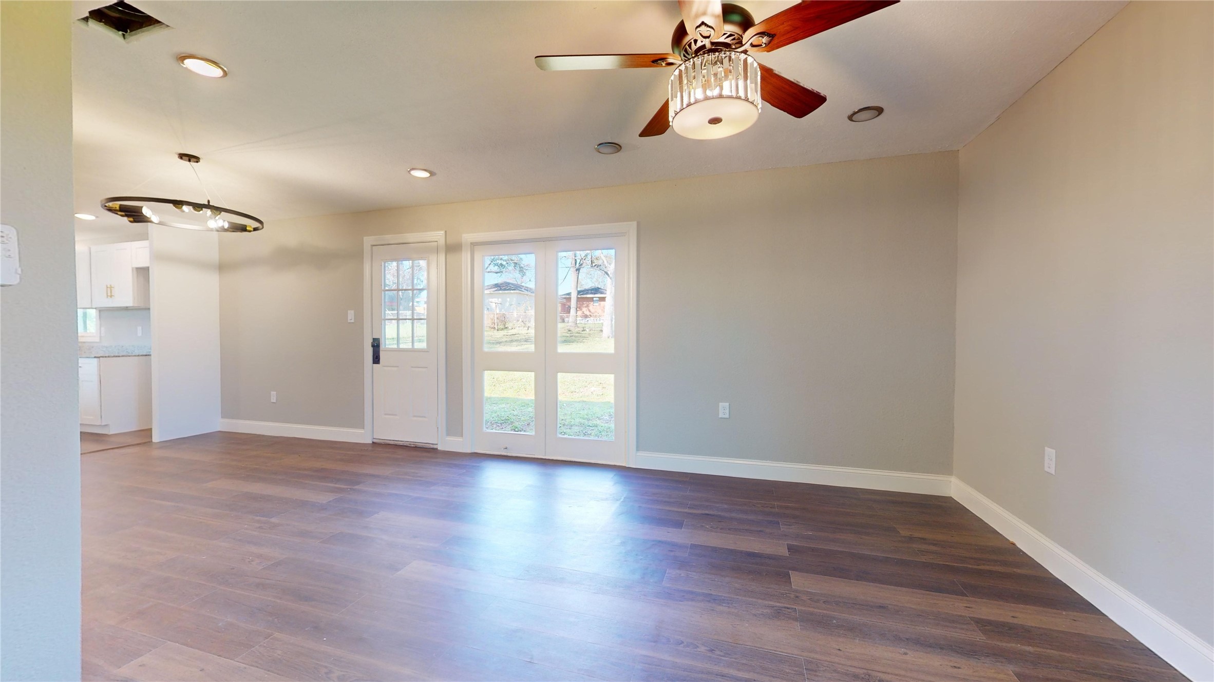603 Maple Way Houston, TX 77015 - Photo 4 of 35 a view of an empty room with a window and wooden floor