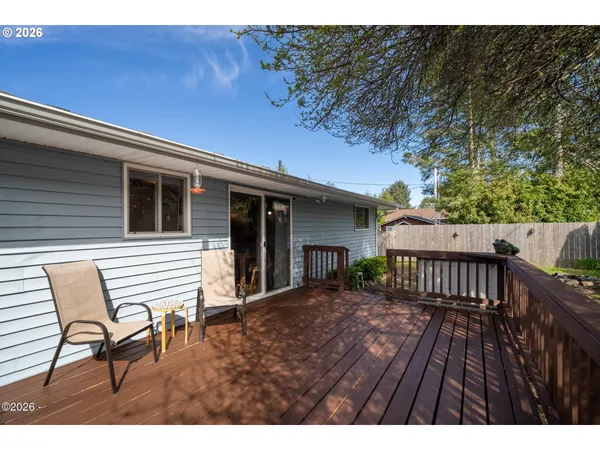 a view of a patio with wooden floor