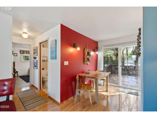a balcony with furniture and view of living room