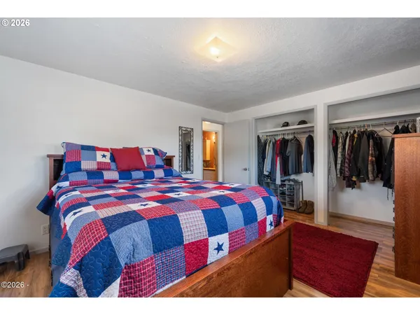 a bedroom with a bed and a walk in closet