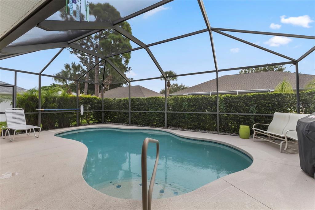 5823 McKinley Road Venice, FL 34293 - Photo 15 of 44 a view of a swimming pool with a porch