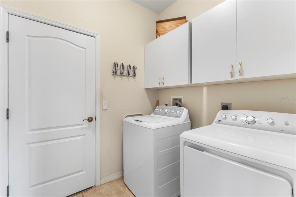 5823 McKinley Road Venice, FL 34293 - Photo 20 of 44 a view of storage and utility room with washer and dryer
