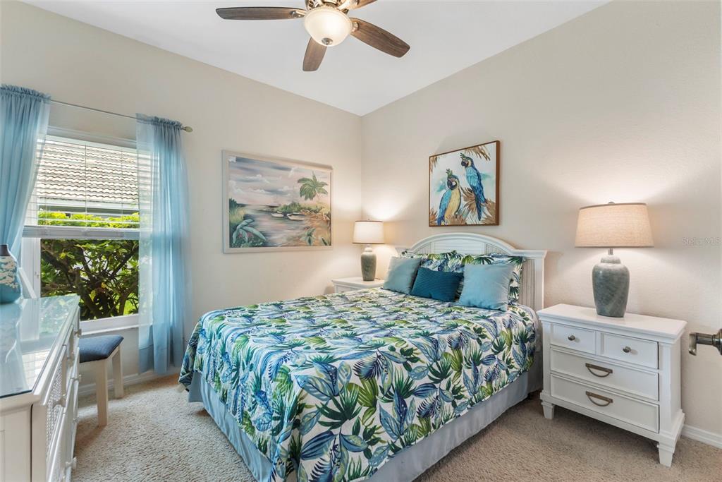 5823 McKinley Road Venice, FL 34293 - Photo 23 of 44 a bedroom with a bed and a painting on the wall