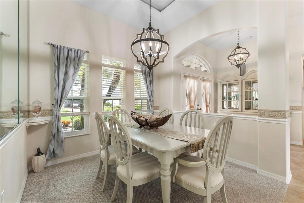 5823 McKinley Road Venice, FL 34293 - Photo 32 of 44 a view of a dining room with furniture window and outside view