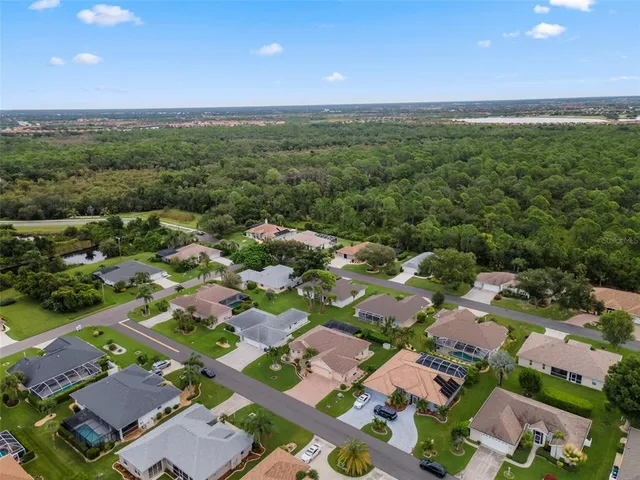 an aerial view of residential houses with outdoor space