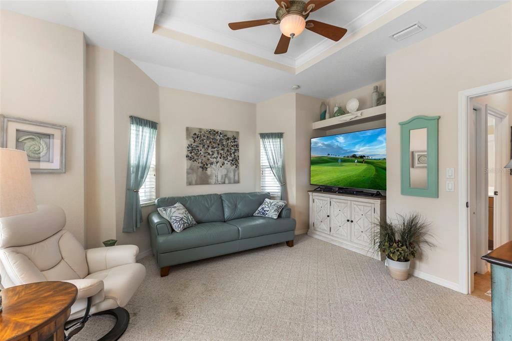 5823 McKinley Road Venice, FL 34293 - Photo 41 of 44 a living room with furniture and a flat screen tv