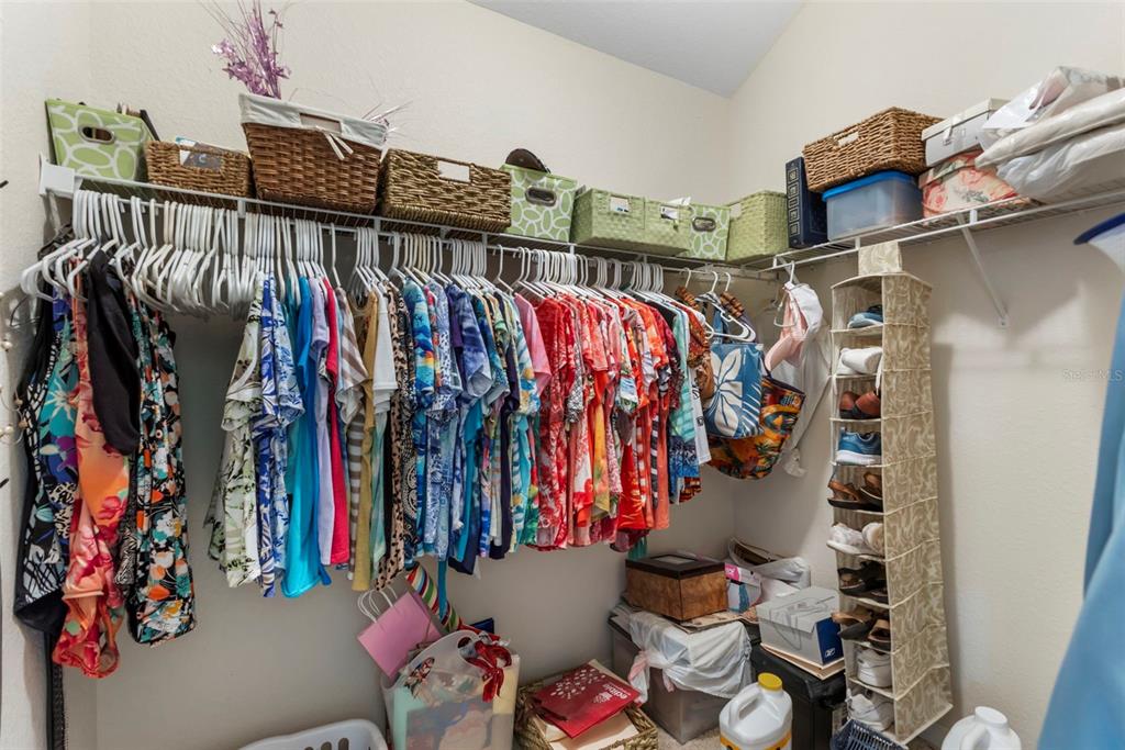 5823 McKinley Road Venice, FL 34293 - Photo 44 of 44 a view of walk in closet with clothes and shoes