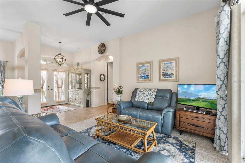 5823 McKinley Road Venice, FL 34293 - Photo 6 of 44 a living room with furniture and a large window
