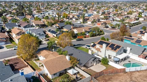 an aerial view of residential houses with outdoor space
